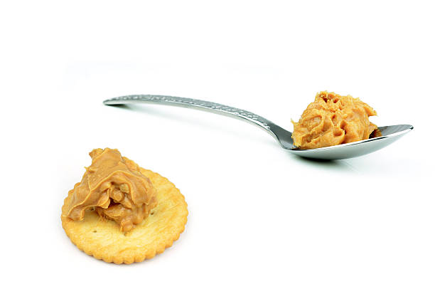 Creamy peanut butter in a spoon stock photo