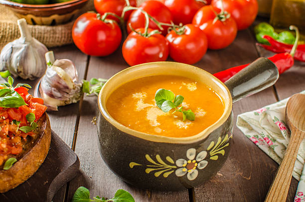 Creamy tomato soup Creamy tomato soup from roasted garlic and tomatoes microgreen gazpacho stock pictures, royalty-free photos & images