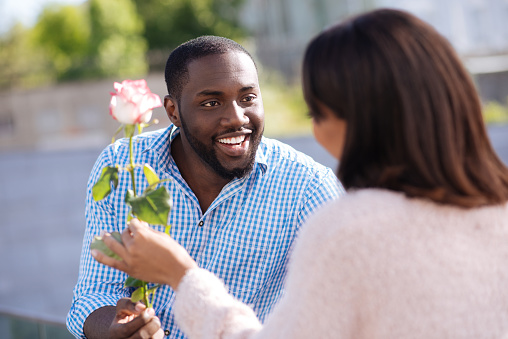 Image result for black man giving his lady flowers