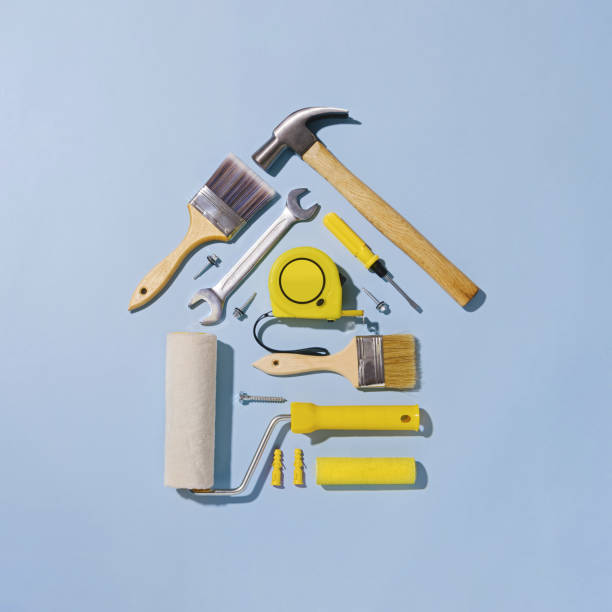 Creative flat lay still life with tools forming a small house stock photo