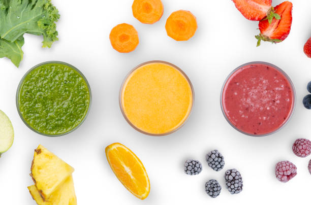 Creative layout of fresh smoothies Creative layout of fresh smoothies with ingredients on white background orange smoothie stock pictures, royalty-free photos & images
