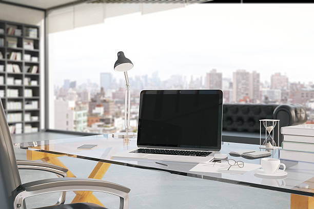 creative office workplace closeup - windows laptop table stockfoto's en -beelden