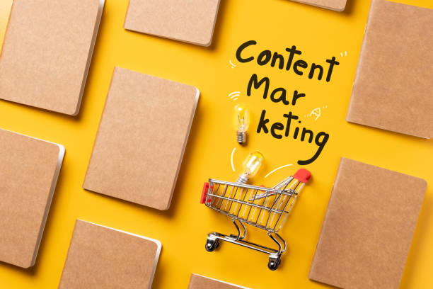 creativity content marketing concept,top view shopping cart with full of lightbulbs with Kraft paper book alignment in pattern on yellow desk surface.leave space for display your content. creativity content marketing concept,top view shopping cart with full of lightbulbs with Kraft paper book alignment in pattern on yellow desk surface.leave space for display your content. content marketing stock pictures, royalty-free photos & images