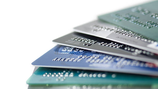 Credit cards close up Many credit cards on white background. Numbers and letters have been retouched until they bear no resemblance to the original. You may also like: pile of credit cards stock pictures, royalty-free photos & images
