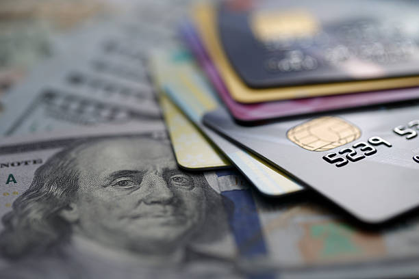 credit cards on dollars stock photo