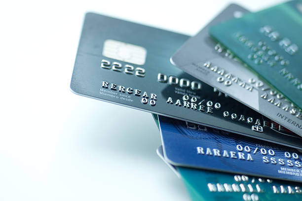 Credit cards on white background Many credit cards on white background. Numbers and letters have been retouched until they bear no resemblance to the original. You may also like:  pile of credit cards stock pictures, royalty-free photos & images