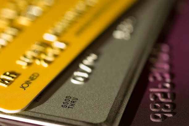 Credit Cards Close up of three credit cards with shallow depth of field pile of credit cards stock pictures, royalty-free photos & images