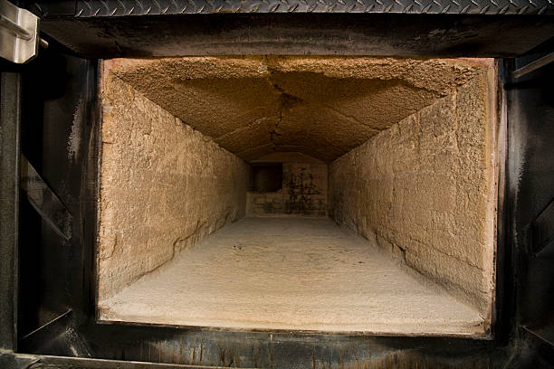 Cremation chamber Combustion chamber inside of a crematorium. crematorium stock pictures, royalty-free photos & images