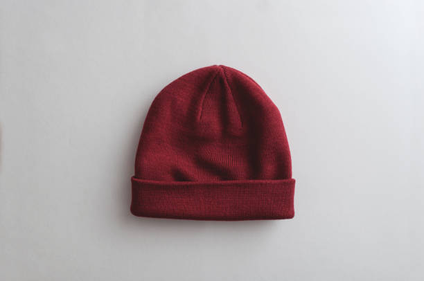 Crimson winter hat Crimson color winter hat on bright white background knit hat stock pictures, royalty-free photos & images