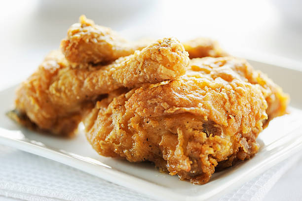 Crispy fried breast and legs from chicken stock photo