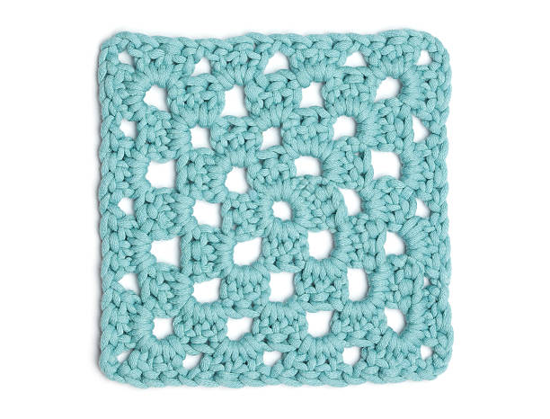 Crochet Doily - Light Blue Granny Square stock photo