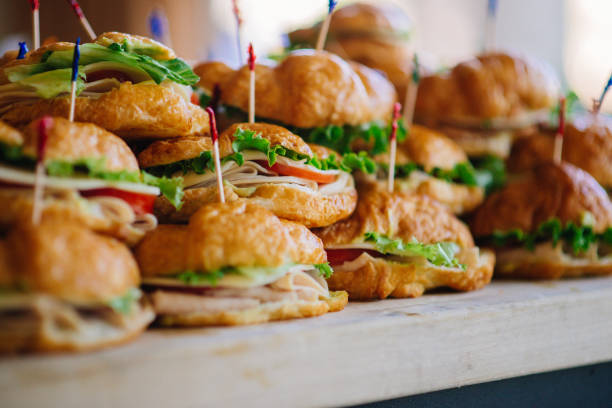 Croissant Sandwich Stack Stack of croissant sandwich at wedding reception party food and beverage industry stock pictures, royalty-free photos & images