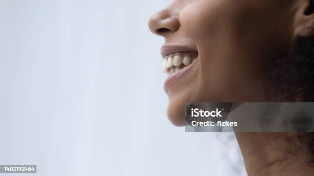 Cropped close up African American smiling woman.