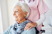 istock Cropped shot of an attractive senior woman looking thoughtful while sitting with a nurse in her room at the retirement home 1346738260