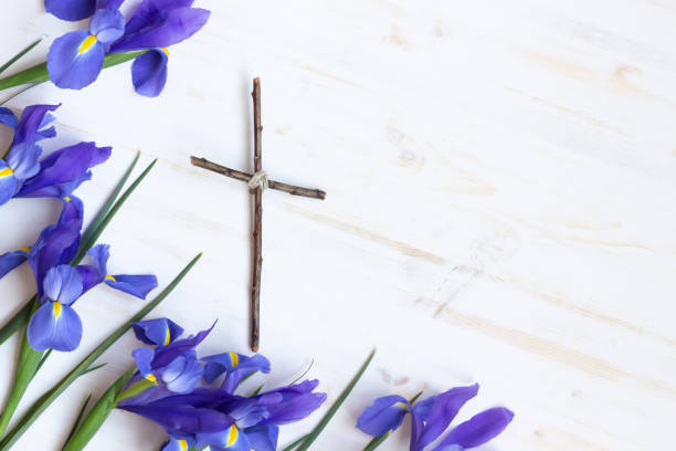 Cross with iris flowers  easter sunday stock pictures, royalty-free photos & images
