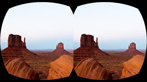 VR cross-eyed 3D headset view caves Monument Valley, sunset stock photo