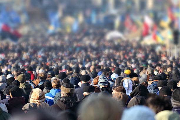 Crowd of anonymous people on street in city center stock photo