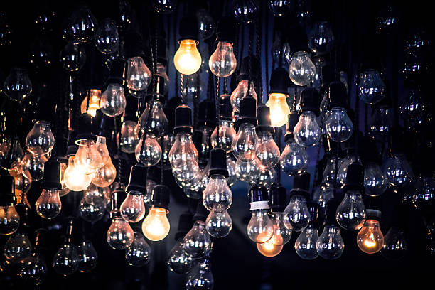 Crowd of Hanging Light Bulbs, Idea concept stock photo