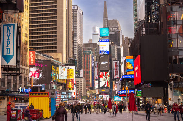 Crowd of people, street neon lights, advertisement, street signs at Times Square, Manhattan . stock photo