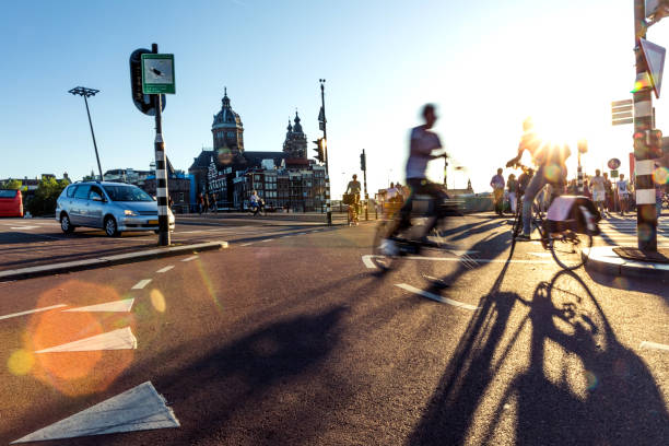 crowded city street cyclists and pedestrians - amsterdam street imagens e fotografias de stock