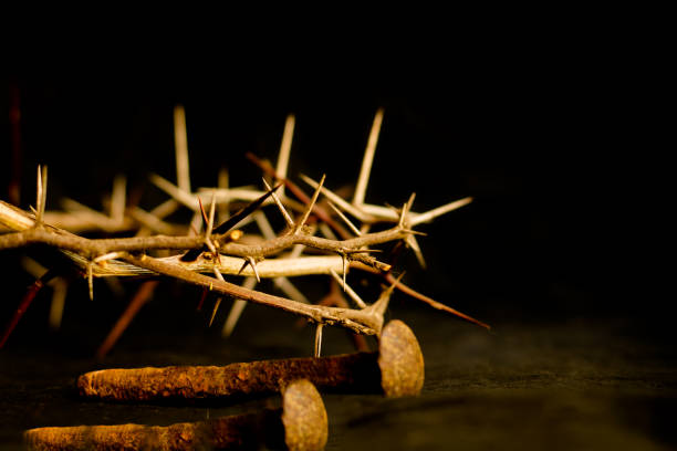 crown of thorns and nails symbols of the Christian crucifixion in Easter crown of thorns and nails symbols of the Christian crucifixion in Easter crucifix stock pictures, royalty-free photos & images