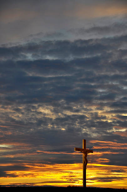 Crucifix at Sunset  good friday stock pictures, royalty-free photos & images