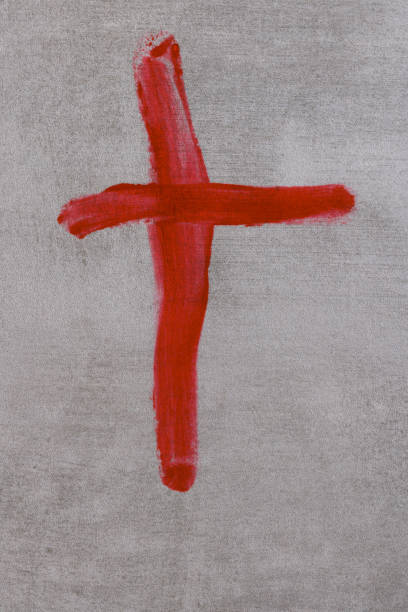 Crucifix ox Jesus Christ made with blood on grey background. Copy space. Top view. Palm Sunday, Good Friday, Easter concept, Christ resurrection, gospel, salvation concept. Banner stock photo