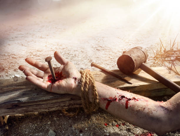 Crucifixion Of Jesus - Christ Nailed On Wooden Cross Crucifixion Of Christ - Nail In Bloody Hand Nailed On Wooden Cross the crucifixion stock pictures, royalty-free photos & images