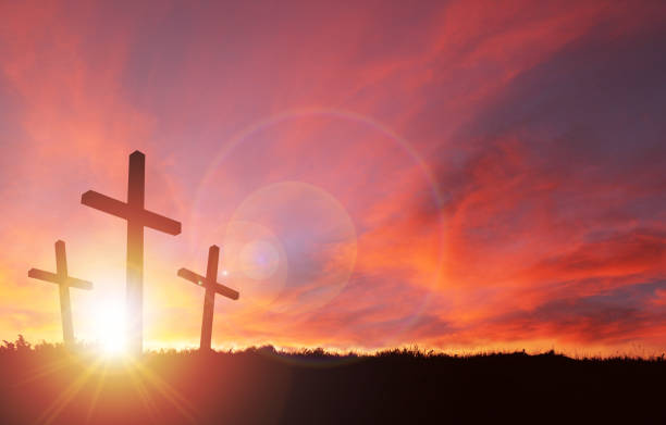 Crucifixion of Jesus With Sunset Sky and Copy Space  easter sunday stock pictures, royalty-free photos & images