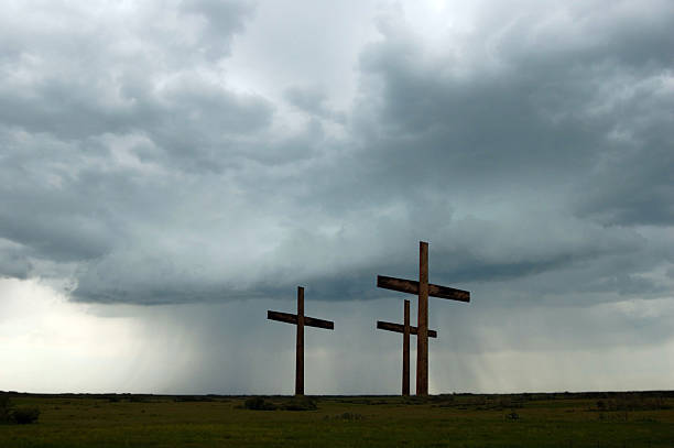 Crucifixion With Approaching Storm  good friday stock pictures, royalty-free photos & images