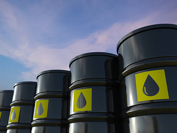 crude oil barrels crude oil barrels with yellow label oil stock pictures, royalty-free photos & images