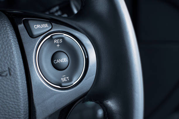 Cruise control button switch on steering wheel. stock photo