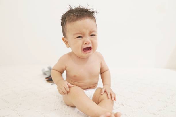 Crying cute little boy. stock photo