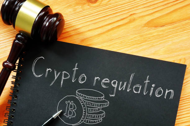 Crypto regulation is shown on the business photo using the text stock photo