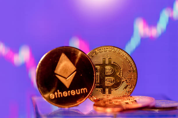 Cryptocurrency bitcoin and ethereum coin displayed on stock charts with market quotes Rezekne, Latvia - March 24, 2021: Cryptocurrency bitcoin and ethereum coin displayed on a stock charts with market quotes  With Ethereum  stock pictures, royalty-free photos & images