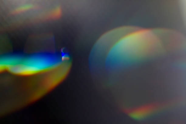 Crystal glow Colourful lens flare on black background. lens flare stock pictures, royalty-free photos & images