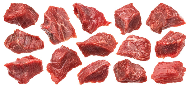 Diced red beef meet, cubes of raw beef isolated on white background with clipping path