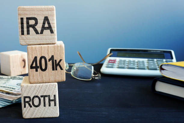 Cubes with words IRA, 401k and ROTH. Retirement plan. Cubes with words IRA, 401k and ROTH. Retirement plan. 401k stock pictures, royalty-free photos & images
