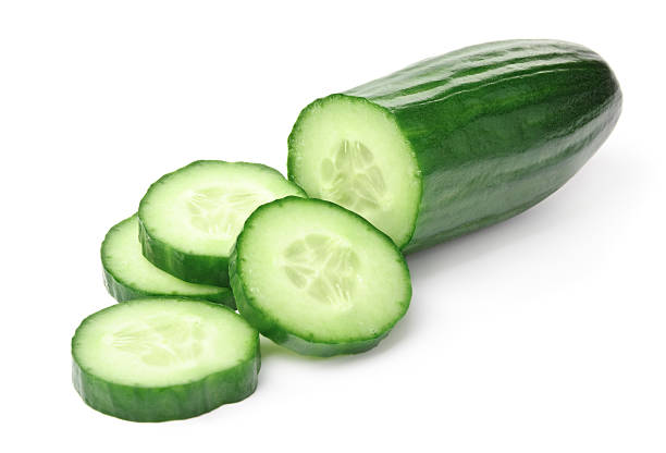 Cucumber slices on a white background  chopped food stock pictures, royalty-free photos & images