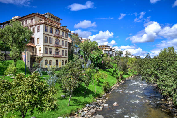 Cuenca and the Tomebamba river Tomebamba river with beautiful houses and architecture, in Cuenca, Azuay, Ecuador ecuador stock pictures, royalty-free photos & images