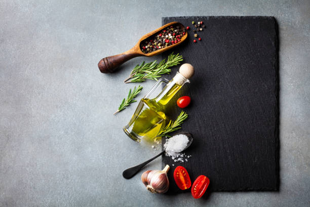 culinary background with kitchen slate board, herbs and various spices. empty place for menu or recipe. top view. - condimento temperos imagens e fotografias de stock