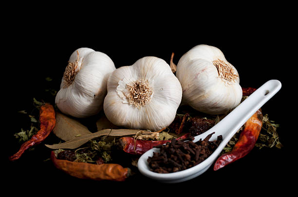 Culinary seasonings for Mediterranean diet Culinary seasonings for Mediterranean diet, isolated on black background garlic photos stock pictures, royalty-free photos & images