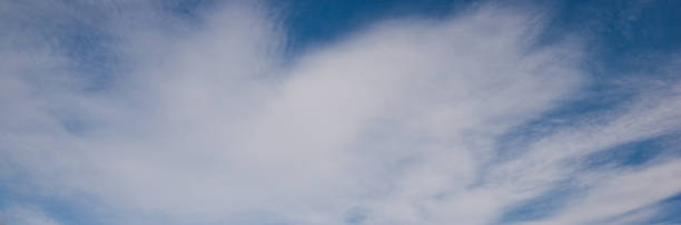 Cumulonimbus Cloud Cumulonimbus clouds appear over Saint Mary Falls in Glacier National Park, Montana, USA. jeff goulden panoramic stock pictures, royalty-free photos & images