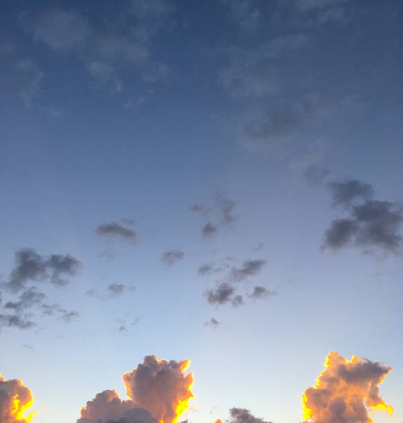 Cumulus Clouds at Sunset Cumulus Clouds appear at sunset over Flagstaff, Arizona, USA. jeff goulden nature backgrounds stock pictures, royalty-free photos & images