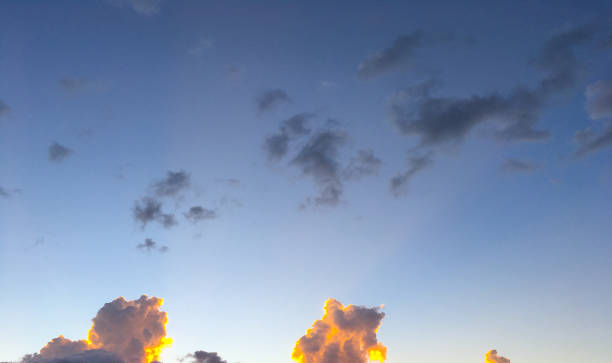 Cumulus Clouds at Sunset Cumulus Clouds appear at sunset over Flagstaff, Arizona, USA. jeff goulden cloud backgrounds stock pictures, royalty-free photos & images