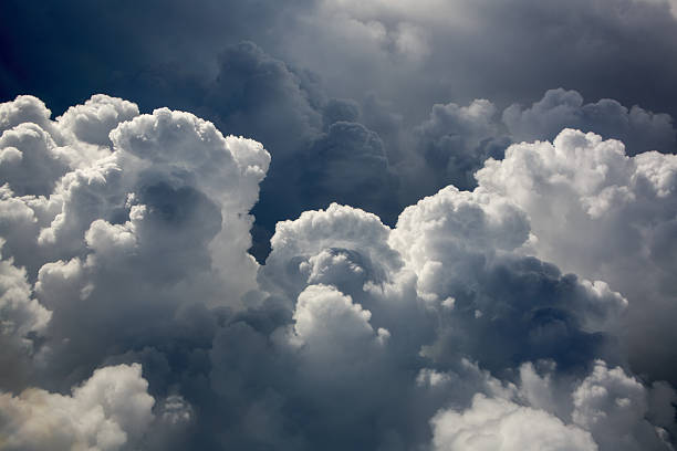 Cumulus Puffy Clouds Puffy Cumulus clouds billow up over south Florida on the edge of a growing storm system cumulus cloud stock pictures, royalty-free photos & images