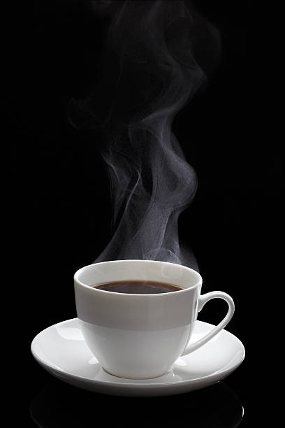 Cup of black coffee Cup of black coffee with steam on the black background black coffee stock pictures, royalty-free photos & images