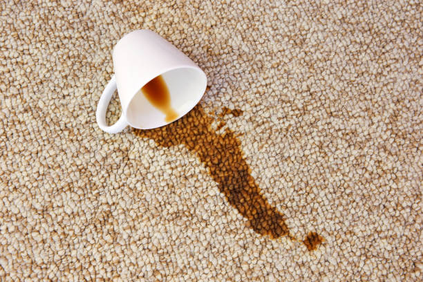 Cup of coffee fell on carpet. Stain is on floor. Cup of coffee fell on carpet. Stain is on floor. spilling stock pictures, royalty-free photos & images