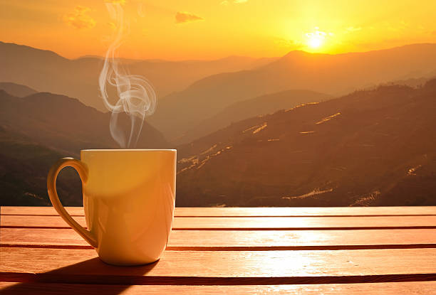 Cup of coffee Morning cup of coffee with mountain background at sunrise sunday coffee stock pictures, royalty-free photos & images