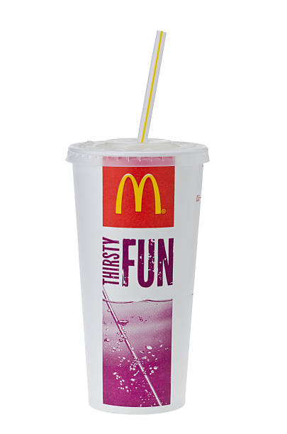 Cup of McDonald's Cola Drink with Straw London, England - January 9, 2013: Cup of McDonald's Cola Drink with Straw Isolated on White Background, mcdonalds drinks stock pictures, royalty-free photos & images